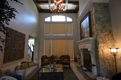 Photo of a medium sized traditional formal enclosed living room in Orlando with beige walls, no tv, travertine flooring, a standard fireplace and a stone fireplace surround.
