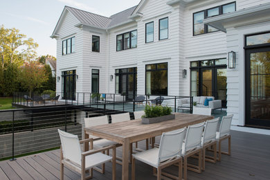 Patio container garden - large transitional backyard patio container garden idea in New York with decking and no cover