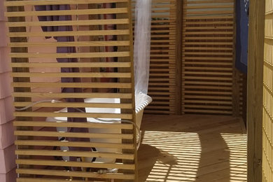 Inspiration for a large eclectic backyard outdoor shower deck remodel in New Orleans with a pergola