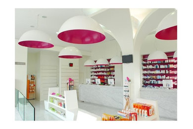 Example of a mid-sized trendy marble floor entryway design in Other with white walls and a glass front door