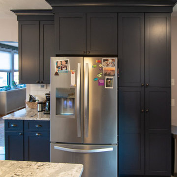 Bathroom/Laundry Room Using Warmer Tones, Accented by New Laundry Facility