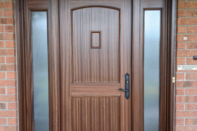 Inspiration for a mid-sized traditional front door in Ottawa with a single front door and a medium wood front door.