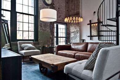 Inspiration for a mid-sized industrial open concept living room in Atlanta with white walls, concrete floors, grey floor, no fireplace and a freestanding tv.