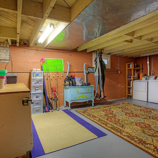Photo of a medium sized classic walk-out basement in Seattle with orange walls and concrete flooring.