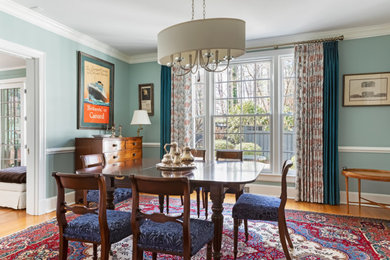 Mid-sized elegant light wood floor kitchen/dining room combo photo in Raleigh with blue walls