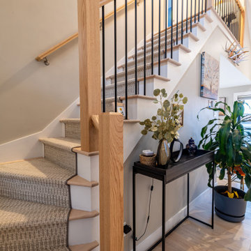 Open Staircase with Modern Railing and Light-Filled Entry – Cape Ann MA