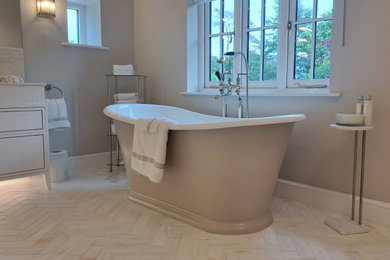 Design ideas for a large contemporary ensuite wet room bathroom in Surrey with flat-panel cabinets, white cabinets, a freestanding bath, a wall mounted toilet, beige tiles, marble tiles, beige walls, marble flooring, a built-in sink, marble worktops, white floors, an open shower, white worktops, an enclosed toilet, double sinks, a freestanding vanity unit and a coffered ceiling.