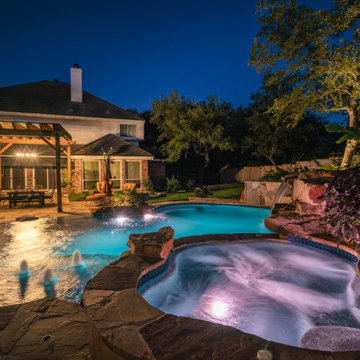Freeform Pool with Negative Edge, Grotto, and Spa