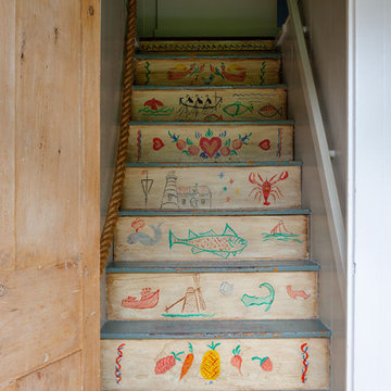 Whimsical Staircase with Hand Painted Seaside Art - Custom Home Renovation - Cap