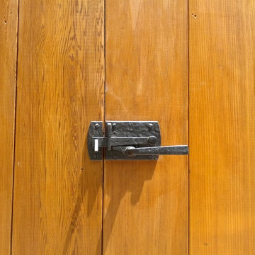 Architectural hardware on trash enclosure
