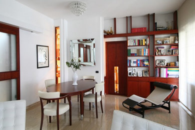 This is an example of a large modern dining room in Rome with white walls and marble floors.