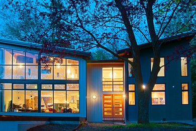 Design ideas for a contemporary exterior in Toronto with metal siding and a shed roof.