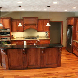 Kitchen cabinetry using maple wood - Pendant Lighting