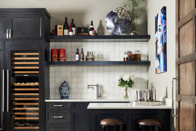 Inspiration for a transitional seated home bar remodel in Dallas with white countertops