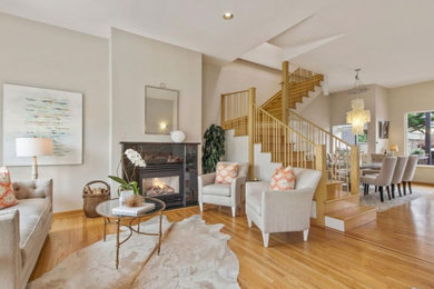 Living room - mid-sized contemporary formal and open concept light wood floor living room idea in Boston with gray walls, a standard fireplace, a tile fireplace and no tv