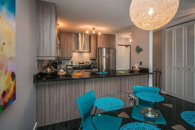 Inspiration for a small contemporary u-shaped porcelain tile eat-in kitchen remodel in Vancouver with an undermount sink, flat-panel cabinets, gray cabinets, granite countertops, stainless steel appliances and no island
