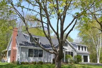 Example of a mid-sized classic blue one-story exterior home design in Boston