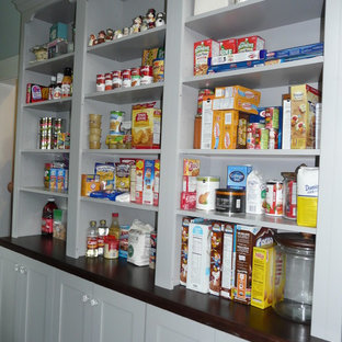 Huge transitional kitchen pantry designs - Inspiration for a huge transitional l-shaped porcelain floor kitchen pantry remodel in Birmingham with a farmhouse sink, shaker cabinets, white cabinets, marble countertops, white backsplash, subway tile backsplash and stainless steel appliances