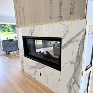 CUSTOM FLOOR-TO-CEILING FIREPLACE WITH MITERED RETURNS