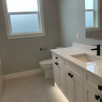 Clean white vanity cabinet installed in remodel project