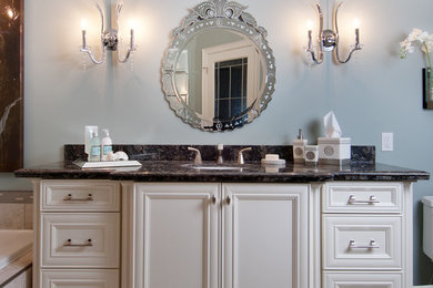 Inspiration for a large timeless master beige tile and ceramic tile ceramic tile and beige floor bathroom remodel in Toronto with furniture-like cabinets, white cabinets, blue walls, an undermount sink and granite countertops