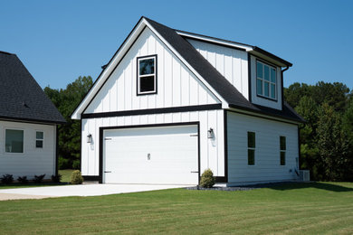 Example of a mid-sized farmhouse detached garage workshop design in Atlanta