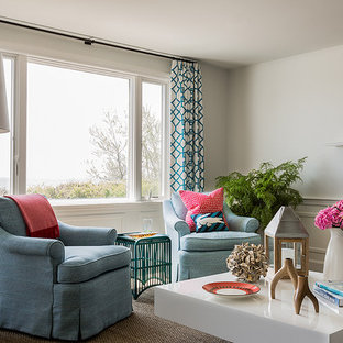 Example of a trendy living room design in Boston with beige walls and a standard fireplace