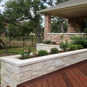 Ipe Hardwood Decking with Metal Framing, Limestone Flower Beds around Deck