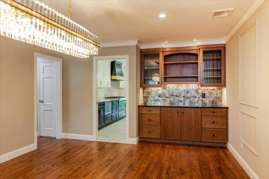 Inspiration for a large 1950s medium tone wood floor, brown floor and wall paneling kitchen/dining room combo remodel in New York with beige walls