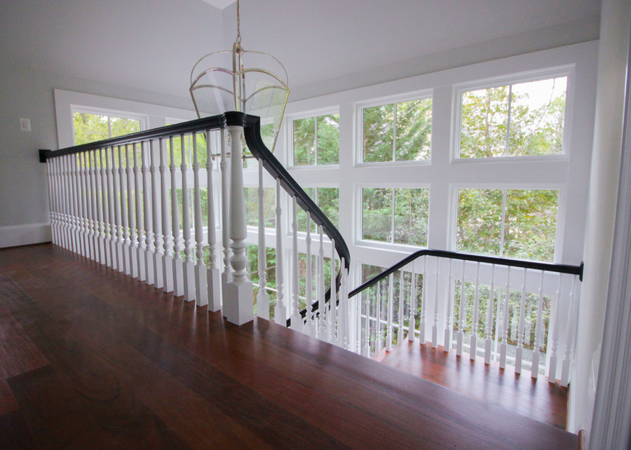 Powerful Impression by Floating Staircase in Suburban Foyer