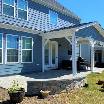 Partially covered Paver Patio with wall seat