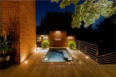 Elevated Porcelain Patio with Stainless Spa, Fire Wall, and Kitchen