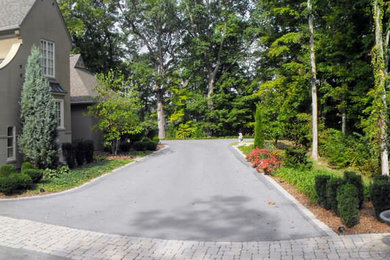 Design ideas for a large traditional partial sun courtyard concrete paver landscaping in Other.