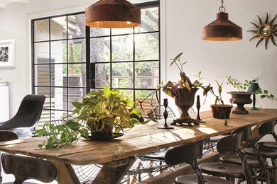 Dining room - mediterranean dining room idea in Los Angeles with white walls