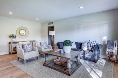 Inspiration for an open concept brown floor family room remodel in Phoenix with beige walls