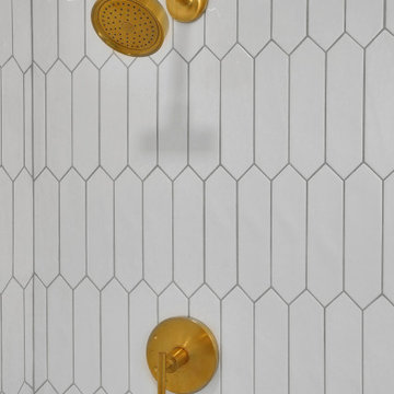 Elevated Bathroom with Gold Finishes