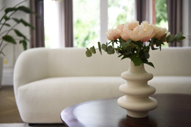 Example of a large classic light wood floor living room design in London