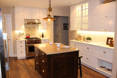 Mid-sized elegant eat-in kitchen photo in Montreal with an undermount sink, recessed-panel cabinets, quartz countertops, stainless steel appliances and an island