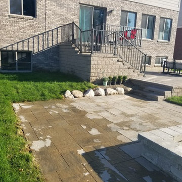 Three Tiered Unilock Patio on a waterfront.