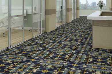 Home office - huge industrial carpeted home office idea in Toronto