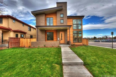 Example of a mid-sized trendy brown two-story mixed siding flat roof design in Denver