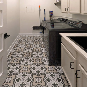 Panoramic Penthouse: Laundry Room with Dark Washer and Built-in Sink