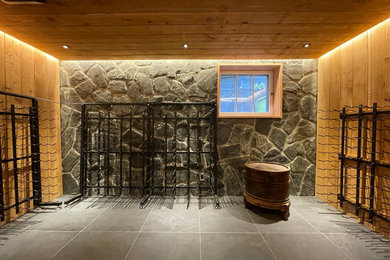 Example of a mid-sized arts and crafts ceramic tile wine cellar design in Other