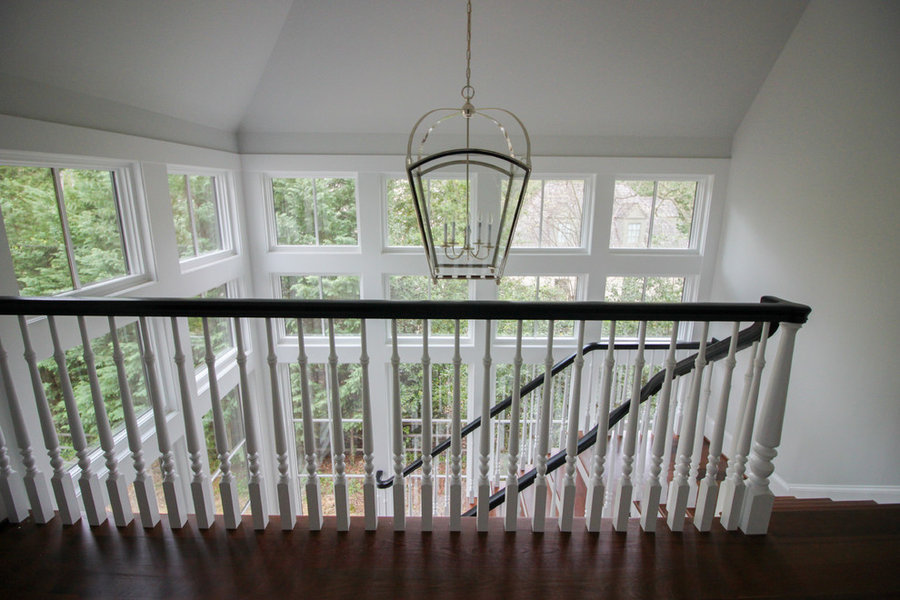 Powerful Impression by Floating Staircase in Suburban Foyer