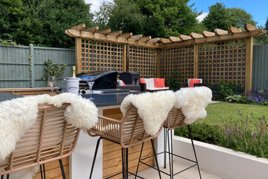 Inspiration for a medium sized modern back full sun garden seating for spring in Essex with a wood fence.