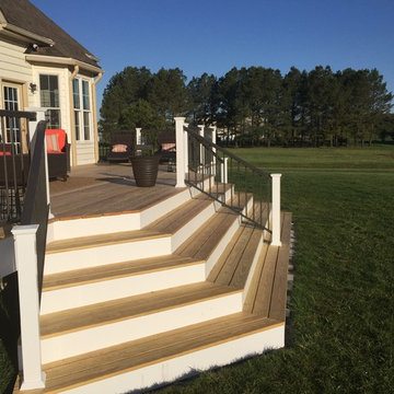 Cascading steps connect the deck to the yard beautifully.