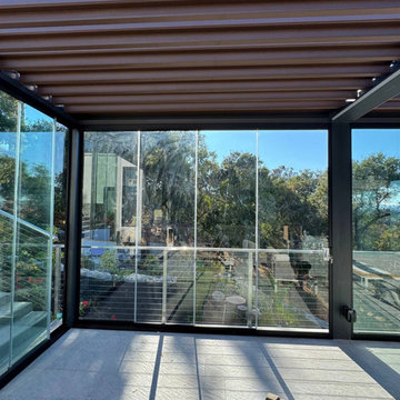 Frameless Sliding Glass Walls for a Panoramic Veranda in California