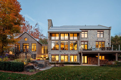 Example of a large cottage home design design in Toronto