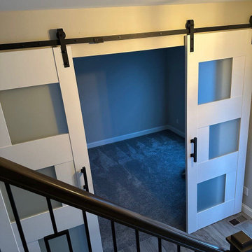 New sliding doors 2026 - Sete 6933 White Silk, double barn doors with black hand