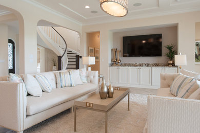 Large transitional formal and open concept ceramic tile living room photo in Jacksonville with a wall-mounted tv and beige walls